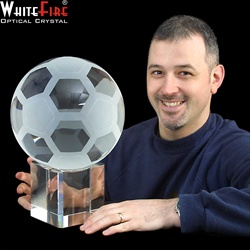 Full size crystal football on base.