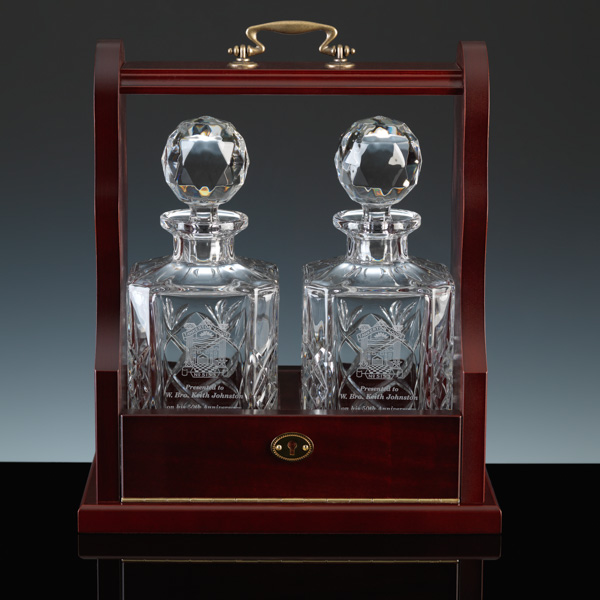 A Tantalus. Cut crystal decanters for engraving.