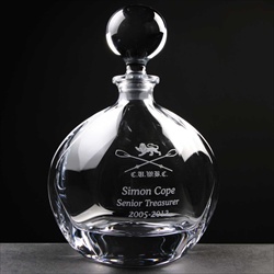 Engraved decanter with ball stopper.