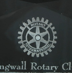 A close-up image of bad quality sandblast engraving.