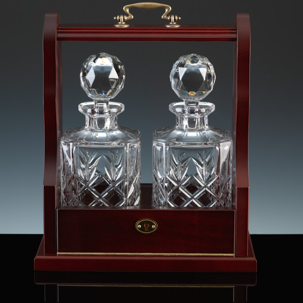A Tantalus with fully cut crystal Decanters.
