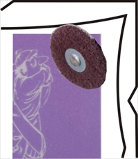 A wire wheel is run over the mask, making tiny holes, to release trapped air. Wire wheel running over mask, pops air bubbles.